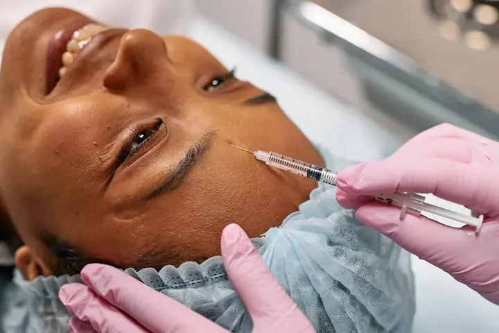 Woman receiving a professional Botox treatment in a clinical setting